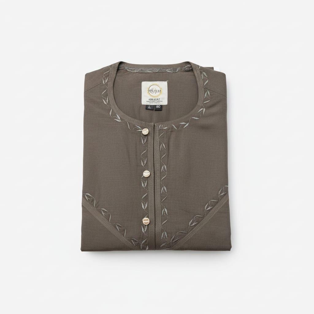 Folded brown shirt with decorative buttons on a white background